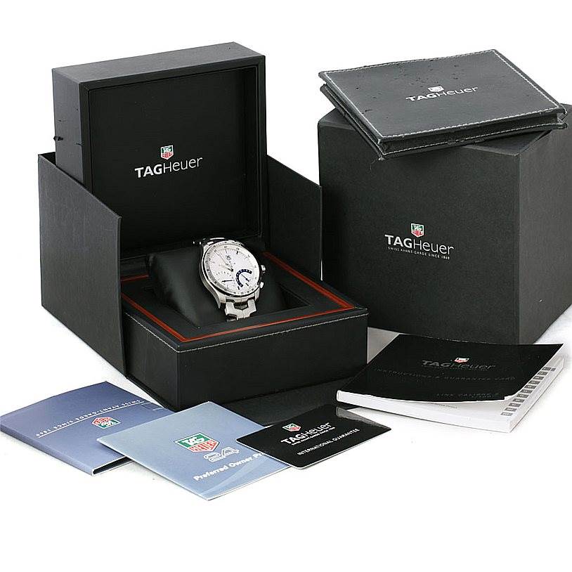 The image shows a Tag Heuer Link CJF2150 Men's Stainless Steel Silver Dial CJF2150 Men's Stainless Steel Silver Dial model watch in its open box, with additional booklets and packaging accessories surrounding it.