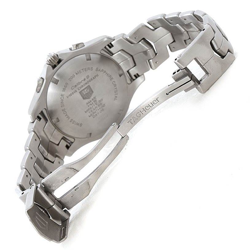 The image shows the back and clasp of a Tag Heuer Link CJF2150 Men's Stainless Steel Silver Dial CJF2150 Men's Stainless Steel Silver Dial model watch, highlighting the engraved details and bracelet design.