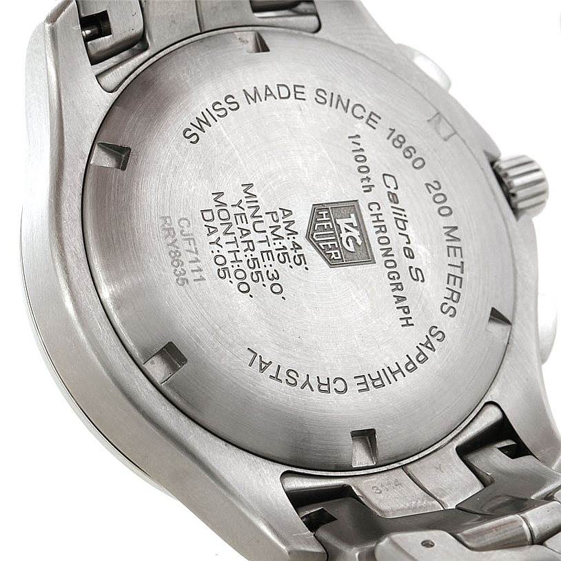 The image shows the back case of a Tag Heuer Link CJF2150 Men's Stainless Steel Silver Dial CJF2150 Men's Stainless Steel Silver Dial model watch, including inscriptions and the bracelet attachment.