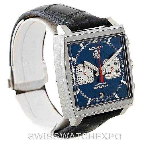 The image shows a Tag Heuer Monaco CW2113 Men's Stainless Steel Blue Dial CW2113 Men's Stainless Steel Blue Dial model watch at a side angle, highlighting its square case, blue dial, and black leather strap.