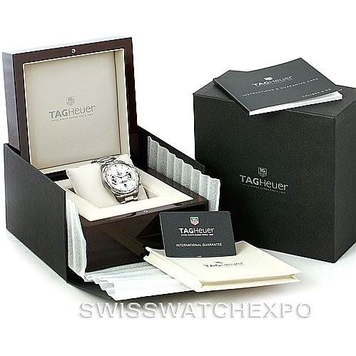The image shows a Tag Heuer Carrera CAV511B Men's Stainless Steel Silver Dial CAV511B Men's Stainless Steel Silver Dial watch from a front angle, along with its open box, warranty cards, and booklet.