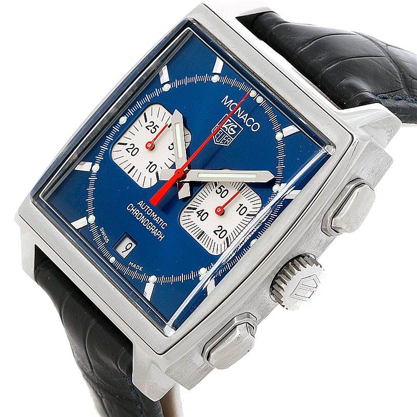 The Tag Heuer Monaco CW2113 Men
s Stainless Steel Blue Dial CW2113 Men
s Stainless Steel Blue Dial watch is shown at a slight angle, highlighting its face, side crown, and buttons, with a visible leather strap.
