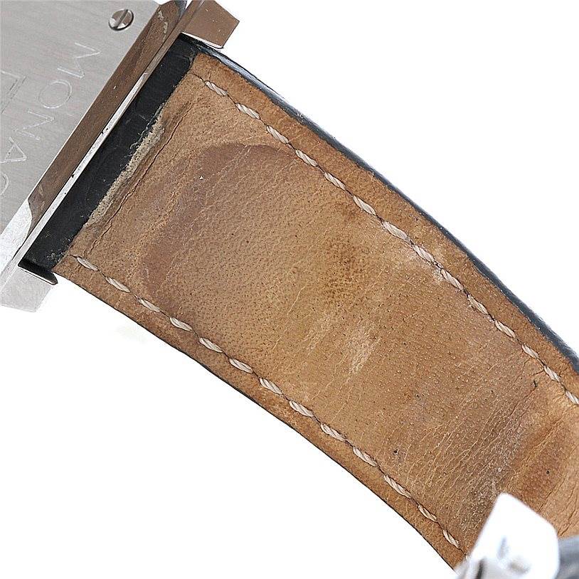 The image shows a close-up of the leather strap and part of the case back of a Tag Heuer Monaco CW2113 Men
s Stainless Steel Blue Dial CW2113 Men
s Stainless Steel Blue Dial watch.