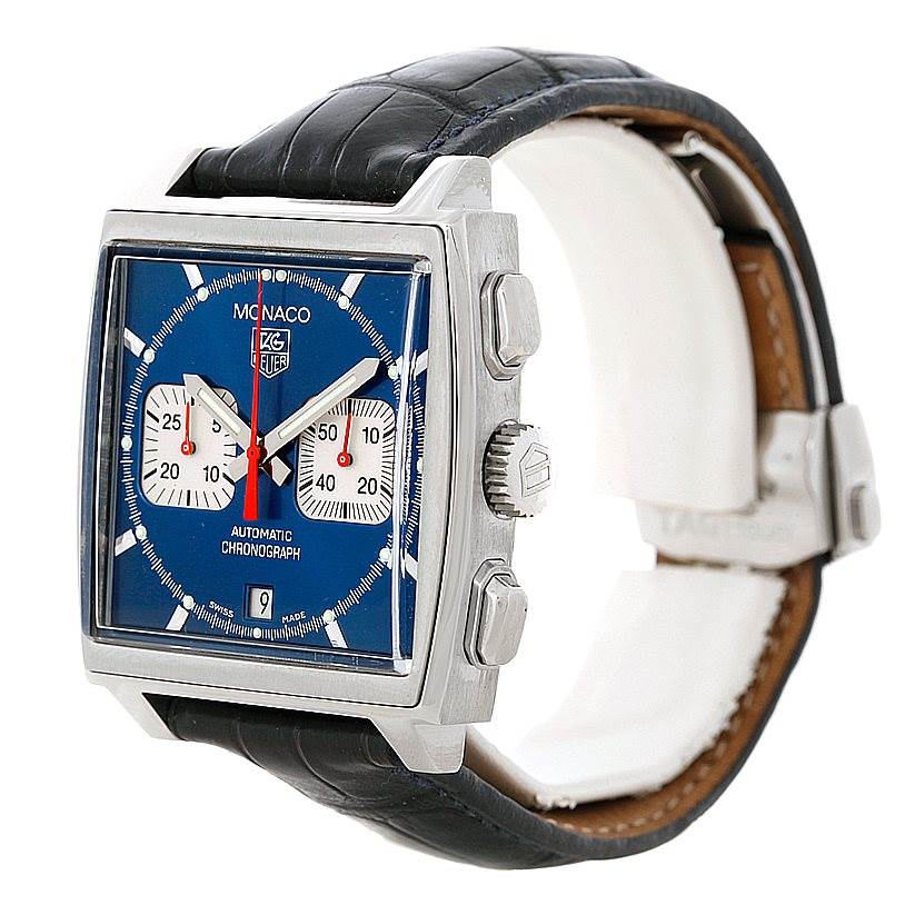 The image shows a side view of the Tag Heuer Monaco CW2113 Men
s Stainless Steel Blue Dial CW2113 Men
s Stainless Steel Blue Dial watch, highlighting its blue dial, square case, and black leather strap.