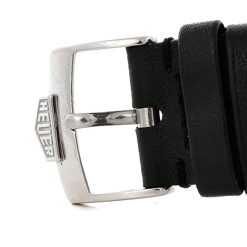 The image shows the buckle and part of the strap of a Tag Heuer Monaco CS2111 Men's Stainless Steel Black Dial CS2111 Men's Stainless Steel Black Dial watch at a close-up angle.