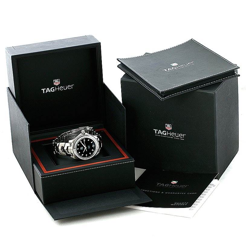 The image shows a Tag Heuer Link WJ1117 Men's Stainless Steel  WJ1117 Men's Stainless Steel  model watch in its open box with additional packaging and manuals beside it.