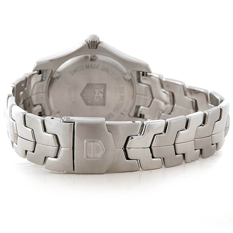 The image displays the Link model by Tag Heuer from the back, showing the stainless steel case and bracelet.