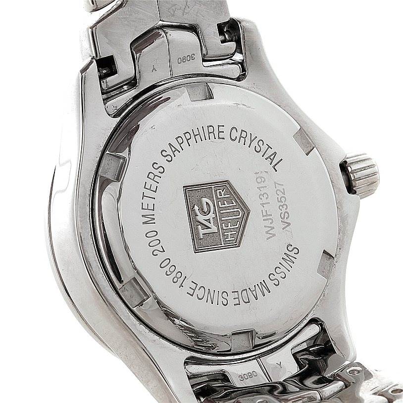 The image shows the back of a Tag Heuer Link WJF1319 Women's Stainless Steel Mother of Pearl Dial WJF1319 Women's Stainless Steel Mother of Pearl Dial watch, focusing on the engraved details and metal clasp.