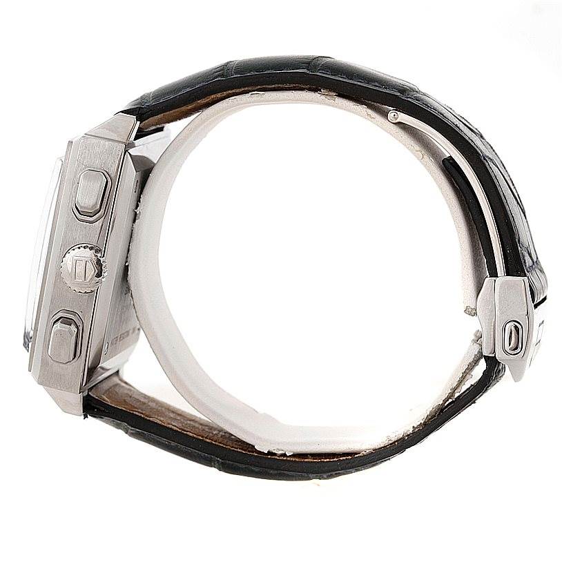 The image shows a side view of the Tag Heuer Monaco CW2113 Men's Stainless Steel Blue Dial CW2113 Men's Stainless Steel Blue Dial watch, featuring the crown, pushers, and part of the leather strap.