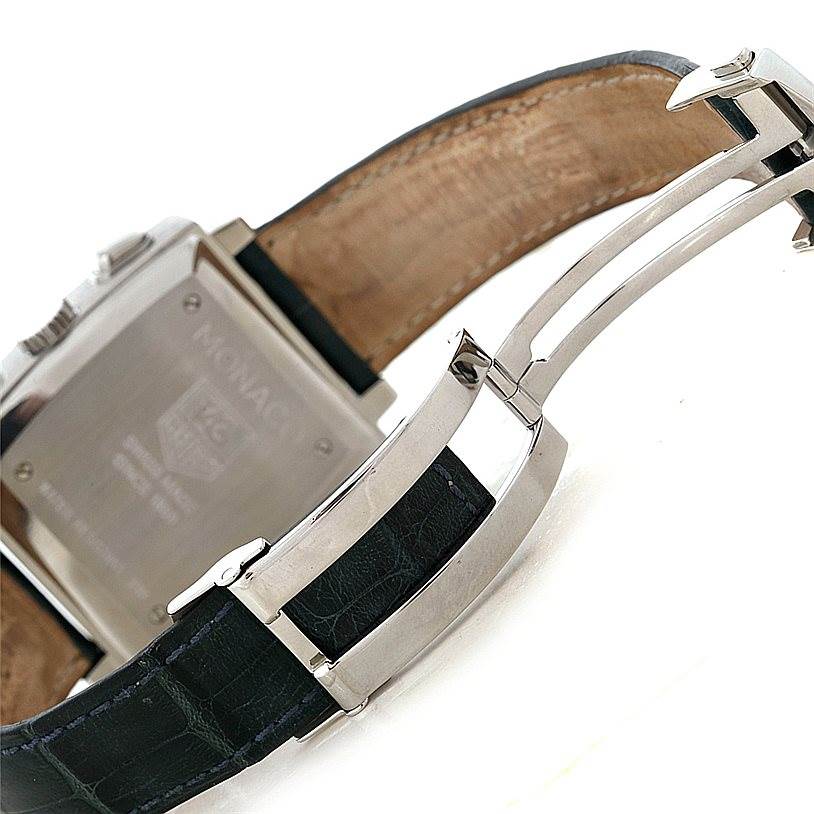 The image shows the clasp and case back of a Tag Heuer Monaco CW2113 Men's Stainless Steel Blue Dial CW2113 Men's Stainless Steel Blue Dial watch, highlighting the deployment buckle and inner strap.