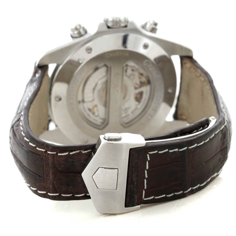 The Tag Heuer Carrera CAV511A.FC6225 Men
s Stainless Steel Black Dial CAV511A.FC6225 Men
s Stainless Steel Black Dial watch is shown from the back, displaying the open case back and leather strap with a deployant clasp.