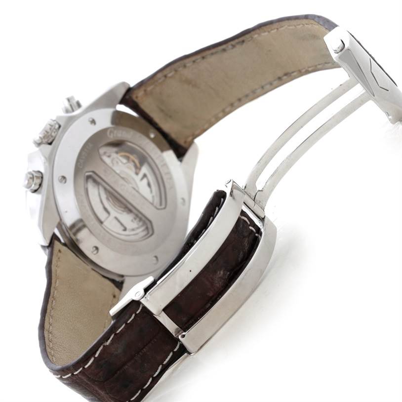 The image shows the case back and clasp of a Tag Heuer Carrera CAV511A.FC6225 Men
s Stainless Steel Black Dial CAV511A.FC6225 Men
s Stainless Steel Black Dial watch, highlighting its leather strap and metal deployment clasp.