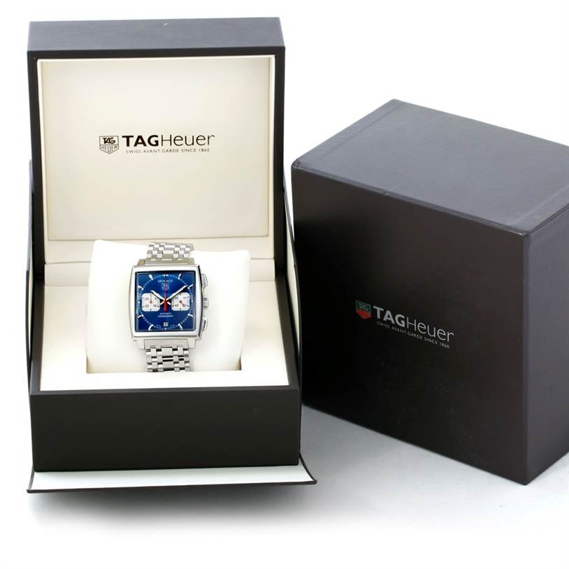 The Tag Heuer Monaco CW2113 Men's Stainless Steel Blue Dial CW2113 Men's Stainless Steel Blue Dial watch is shown inside its open box, with an additional closed box to the right.