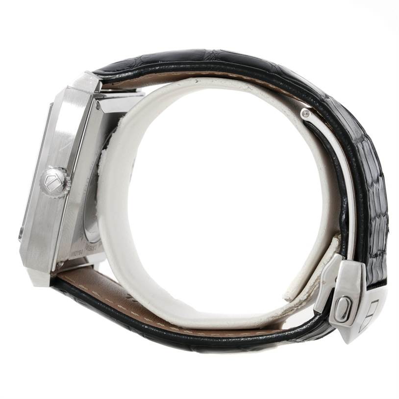 The image shows a side view of the Tag Heuer Monaco WW2110 Men's Stainless Steel Black Dial WW2110 Men's Stainless Steel Black Dial watch, highlighting its crown, case profile, and black leather strap.