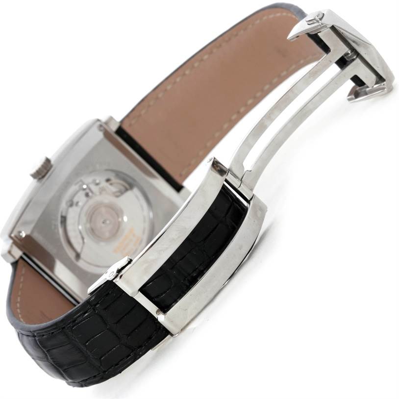 The image shows the backside and partial leather strap of the Tag Heuer Monaco WW2110 Men's Stainless Steel Black Dial WW2110 Men's Stainless Steel Black Dial watch, including the clasp and the watch's movement through the case back.