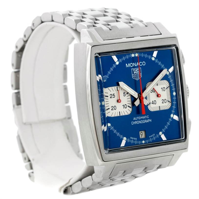 The image shows a Tag Heuer Monaco CW2113 Men's Stainless Steel Blue Dial CW2113 Men's Stainless Steel Blue Dial watch from a front angle, highlighting its square face, blue dial, and metal bracelet.