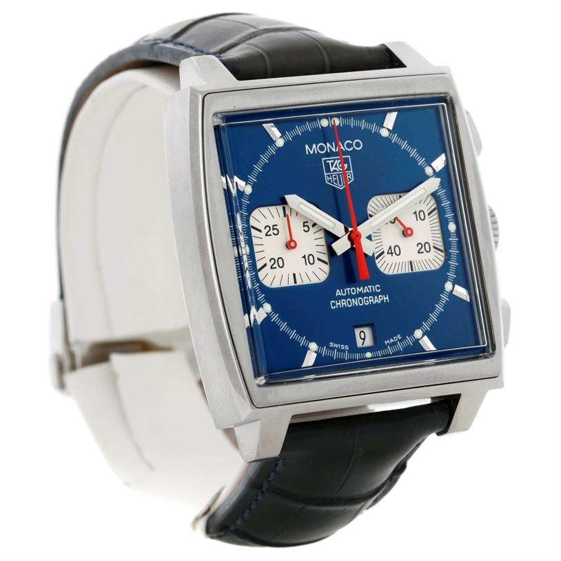 The image shows a three-quarter view of the Tag Heuer Monaco CW2113 Men
s Stainless Steel Blue Dial CW2113 Men
s Stainless Steel Blue Dial watch, displaying its blue dial, square case, subdials, and black strap.