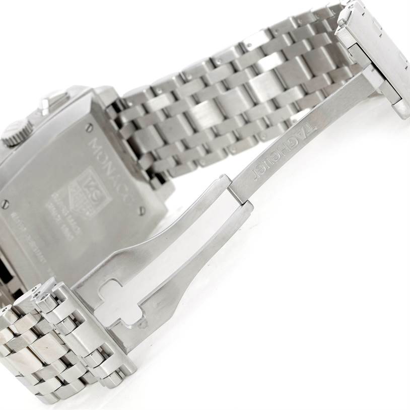 The image shows the angled view of the back case and metal bracelet clasp of a Tag Heuer Monaco CW2113 Men's Stainless Steel Blue Dial CW2113 Men's Stainless Steel Blue Dial watch.