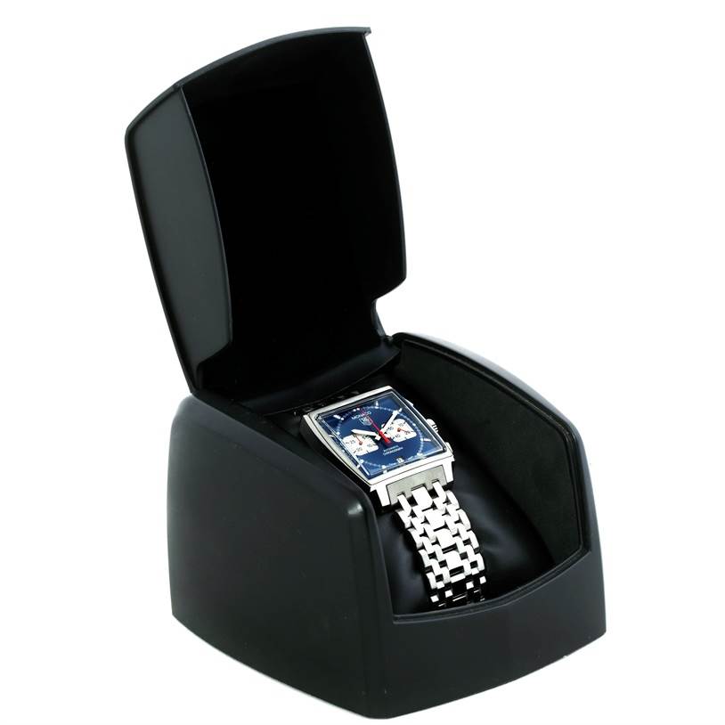 The Tag Heuer Monaco CW2113 Men's Stainless Steel Blue Dial CW2113 Men's Stainless Steel Blue Dial watch is displayed at an angle, placed in an open case, showcasing its face and metal bracelet.