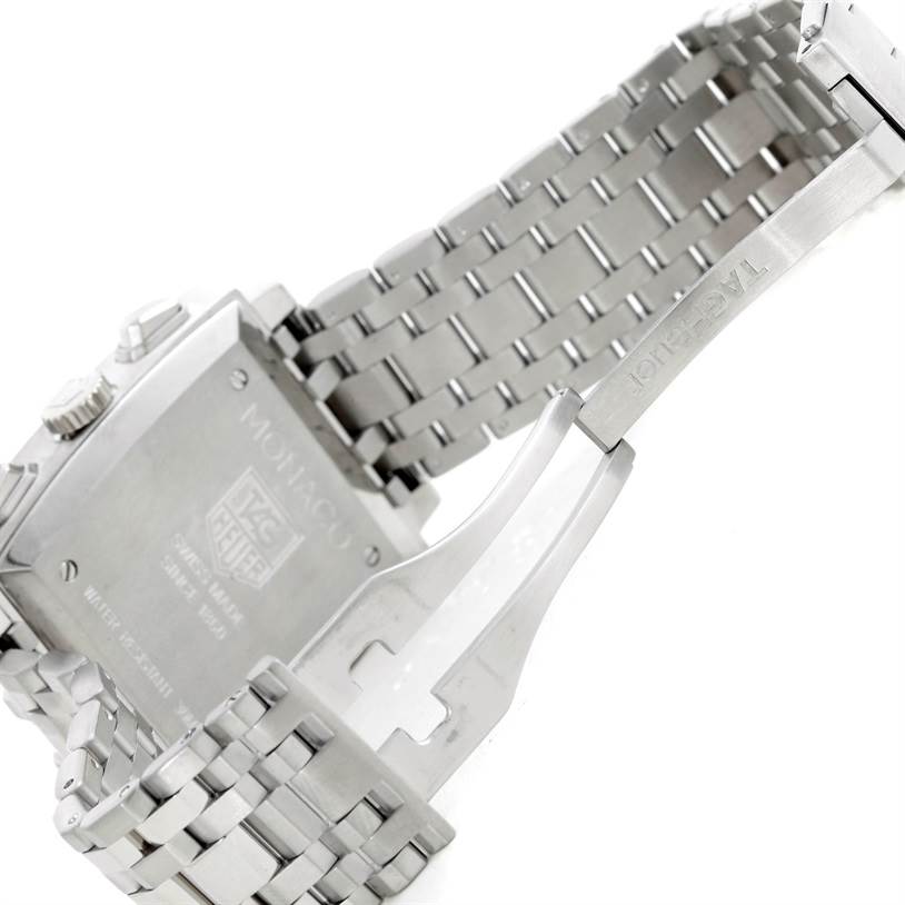 The image shows the back of a Tag Heuer Monaco CW2113 Men's Stainless Steel Blue Dial CW2113 Men's Stainless Steel Blue Dial watch and its partially opened metal bracelet.