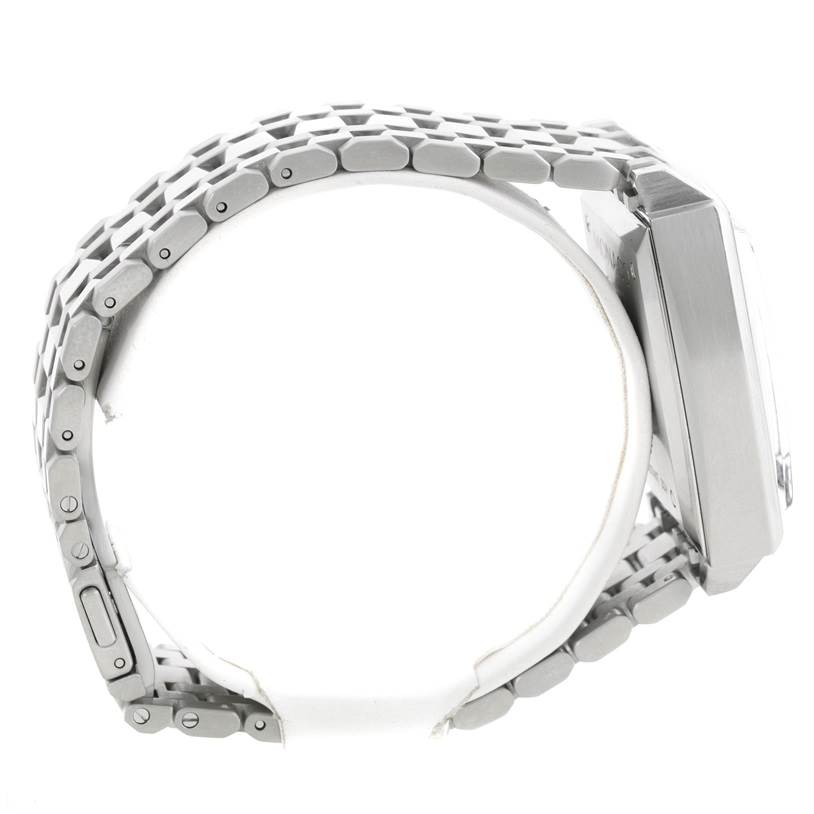 This image shows a side view of the Tag Heuer Monaco CW2113 Men's Stainless Steel Blue Dial CW2113 Men's Stainless Steel Blue Dial watch, focusing on the metal bracelet and case.