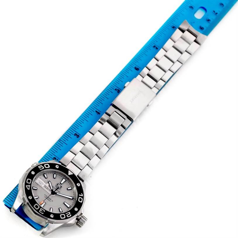 The Tag Heuer Aquaracer WAJ2111 Men's Stainless Steel Grey Dial WAJ2111 Men's Stainless Steel Grey Dial watch is shown at a slight angle, displaying the face, bezel, and full bracelet next to a ruler.