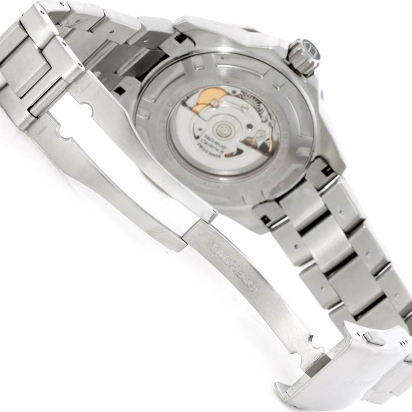 The image shows the back view of a Tag Heuer Aquaracer WAJ2111 Men's Stainless Steel Grey Dial WAJ2111 Men's Stainless Steel Grey Dial watch, focusing on its open clasp and detailed case back.
