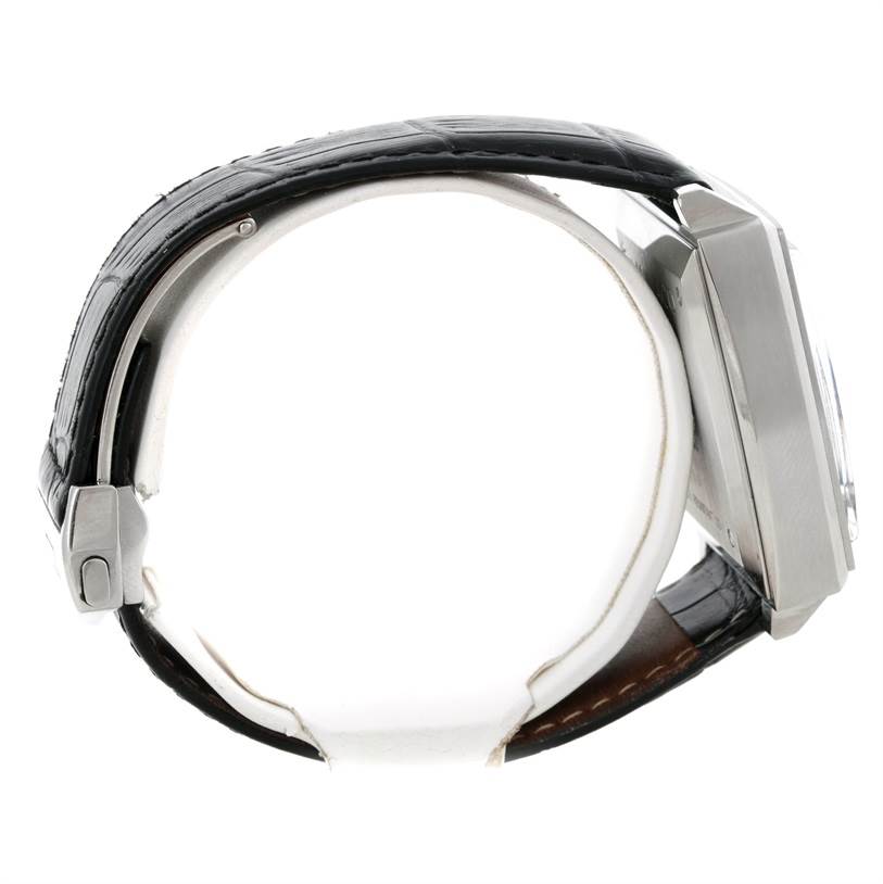 The image shows a side view of the Tag Heuer Monaco CW2111 Men
s Stainless Steel Black Dial CW2111 Men
s Stainless Steel Black Dial watch, highlighting the strap, case, and part of the crown.