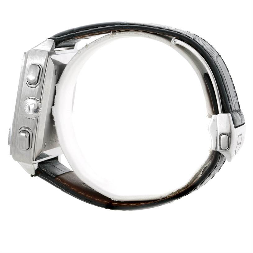 The image shows a side view of the Tag Heuer Monaco CW2111 Men
s Stainless Steel Black Dial CW2111 Men
s Stainless Steel Black Dial watch, highlighting the pushers, crown, and part of the leather strap.