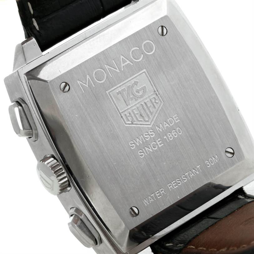 The image shows the back case of a Tag Heuer Monaco CW2111 Men
s Stainless Steel Black Dial CW2111 Men
s Stainless Steel Black Dial watch, including the crown, pushers, and part of the leather strap.