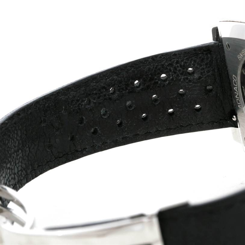 The image shows a close-up side view of the black leather strap and part of the back case of the Tag Heuer Monaco Limited Edition watch.