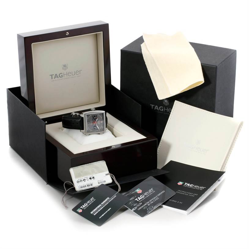 The image shows a Tag Heuer Limited Edition CAW211B Men's Stainless Steel Grey Dial CAW211B Men's Stainless Steel Grey Dial watch model displayed inside its box, alongside accompanying accessories and manuals.