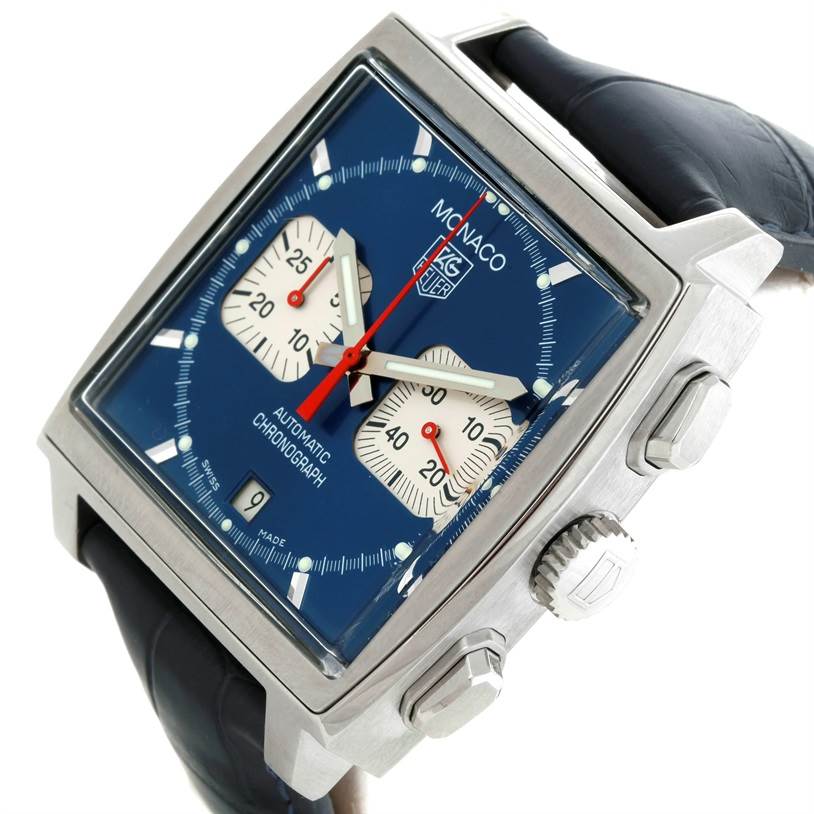 The image shows a Tag Heuer Monaco CW2113 Men
s Stainless Steel Blue Dial CW2113 Men
s Stainless Steel Blue Dial watch at an angled close-up, highlighting the blue dial, two sub-dials, and the crown.