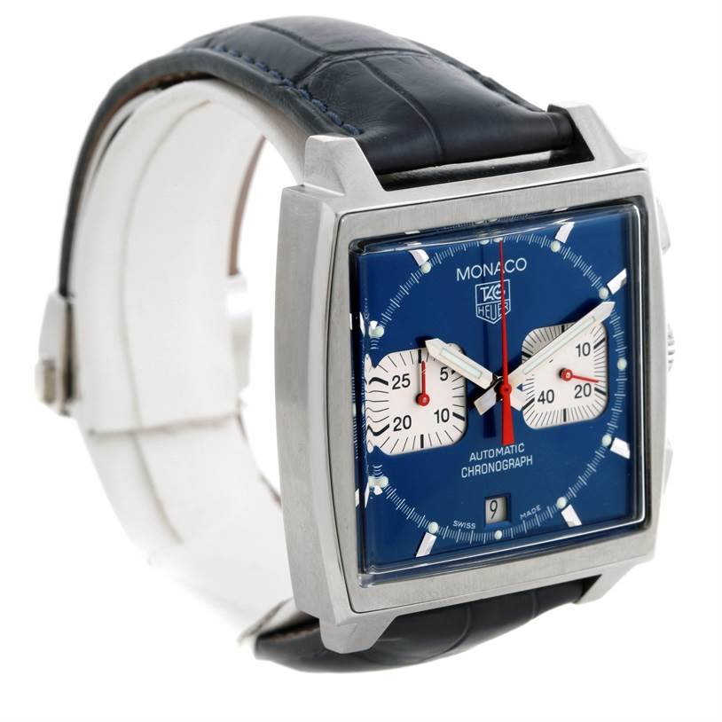 The image shows a side angle of the Tag Heuer Monaco CW2113 Men
s Stainless Steel Blue Dial CW2113 Men
s Stainless Steel Blue Dial watch, featuring its square face, blue dial, and black leather strap.