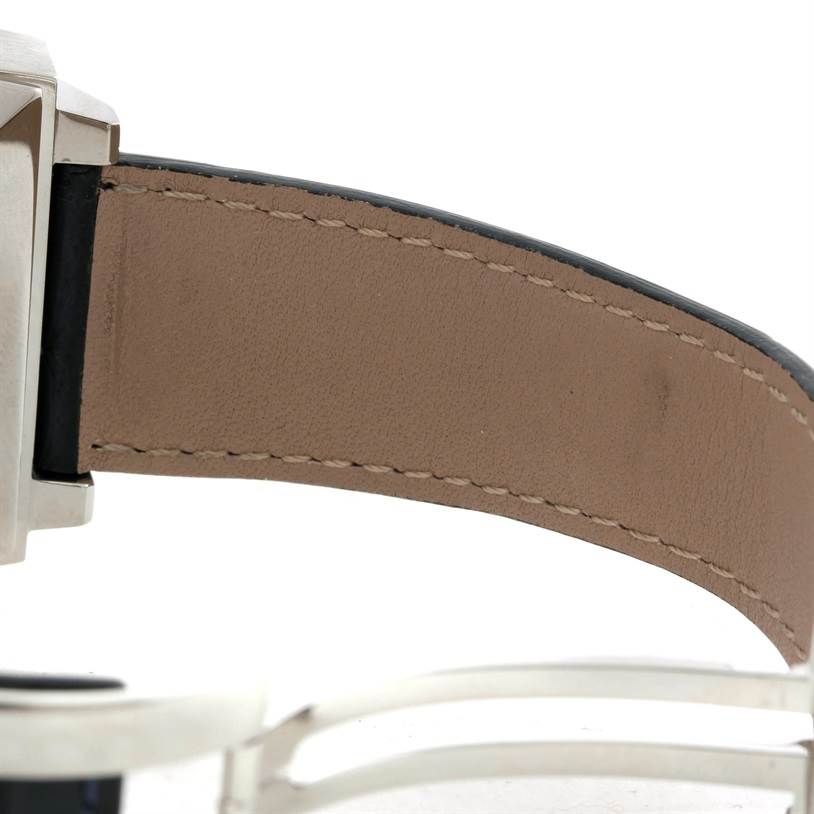 The image shows a close-up of the Tag Heuer Monaco CW2113 Men
s Stainless Steel Blue Dial CW2113 Men
s Stainless Steel Blue Dial watch
s leather strap and clasp from a side angle.