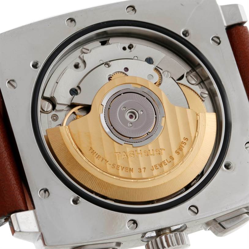 The image shows the back view of the Tag Heuer Monaco CS2111 Men's Stainless Steel Black Dial CS2111 Men's Stainless Steel Black Dial watch, highlighting its movement and rotor.