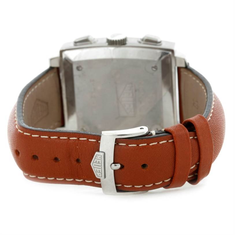 This image shows the back view of a Tag Heuer Monaco CS2111 Men's Stainless Steel Black Dial CS2111 Men's Stainless Steel Black Dial watch, including its brown leather strap and buckle.