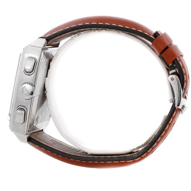 This image shows a side view of the Tag Heuer Monaco CS2111 Men's Stainless Steel Black Dial CS2111 Men's Stainless Steel Black Dial model watch, highlighting its crown, push buttons, case, and brown leather strap.