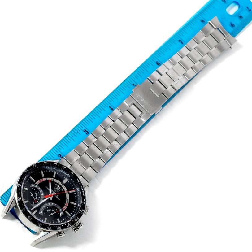 The Tag Heuer Carrera CV7A10 Men's Stainless Steel Black Dial CV7A10 Men's Stainless Steel Black Dial model watch is shown at a top view angle, featuring its face and metal bracelet next to a ruler.