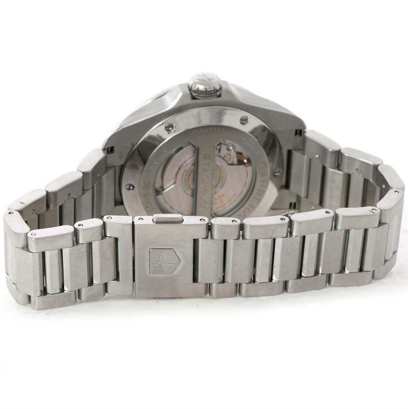 The image shows the back view of a Tag Heuer Carrera WAV5111 Men
s Stainless Steel Black Dial WAV5111 Men
s Stainless Steel Black Dial watch, highlighting the bracelet and transparent case back.