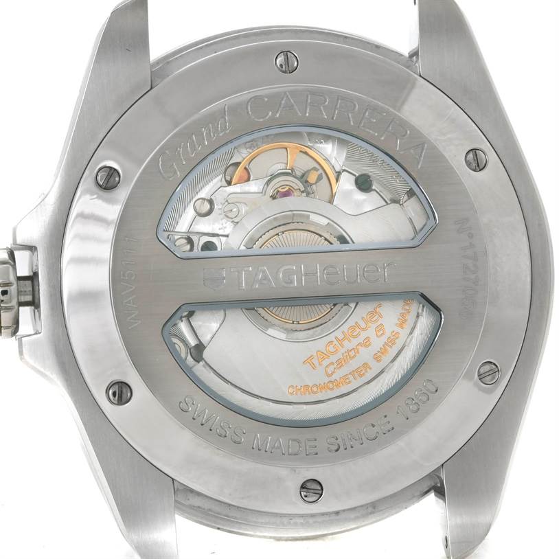 The image shows the back view of a Tag Heuer Carrera WAV5111 Men
s Stainless Steel Black Dial WAV5111 Men
s Stainless Steel Black Dial watch, revealing the internal mechanism and engraving details.
