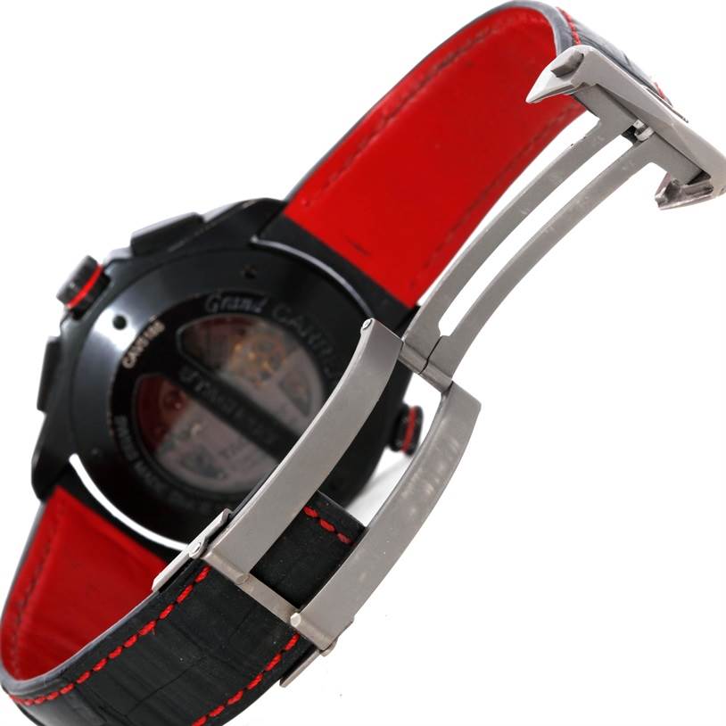 The image shows the angled back view of a Tag Heuer Carrera CAV5185.FC6237 Men's Titanium Black Dial CAV5185.FC6237 Men's Titanium Black Dial watch, focusing on the clasp and black-red straps.