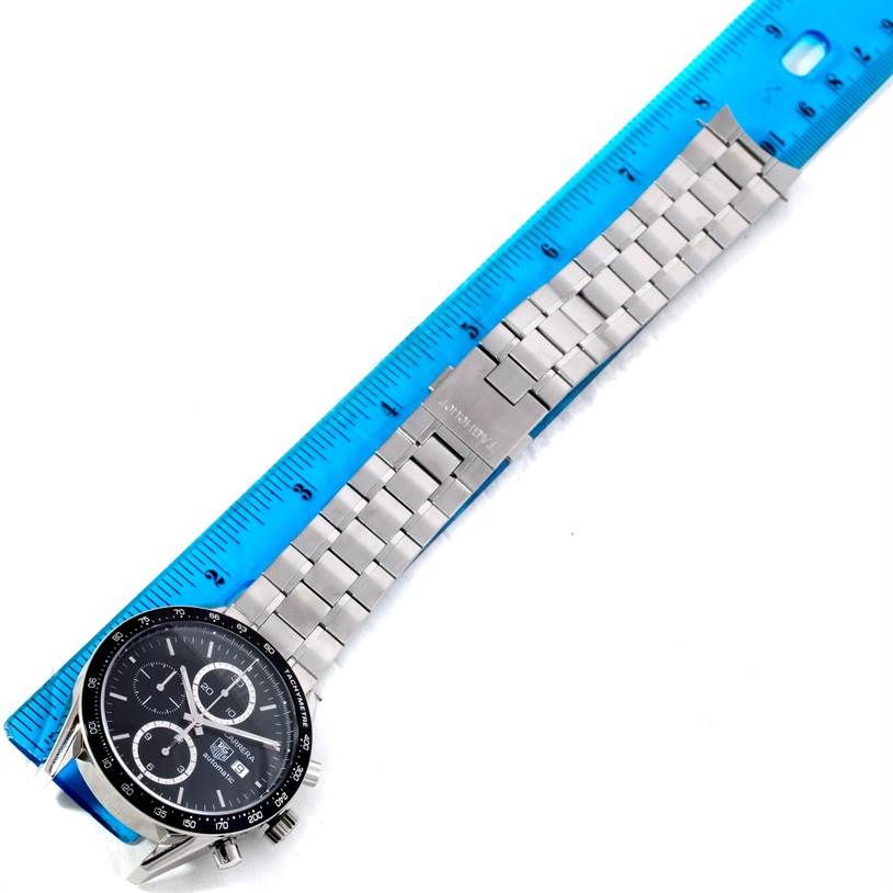 The image shows a top-down view of a Tag Heuer Carrera CV2010-3 Men's Stainless Steel Black Dial CV2010-3 Men's Stainless Steel Black Dial watch alongside a ruler for measurement.