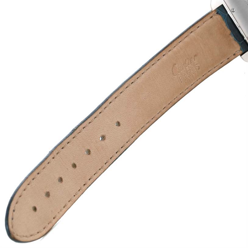 This image shows the tan leather strap of a Cartier Tank Americaine W2603256 Men's White Gold Silver Dial W2603256 Men's White Gold Silver Dial watch, viewed from the underside.