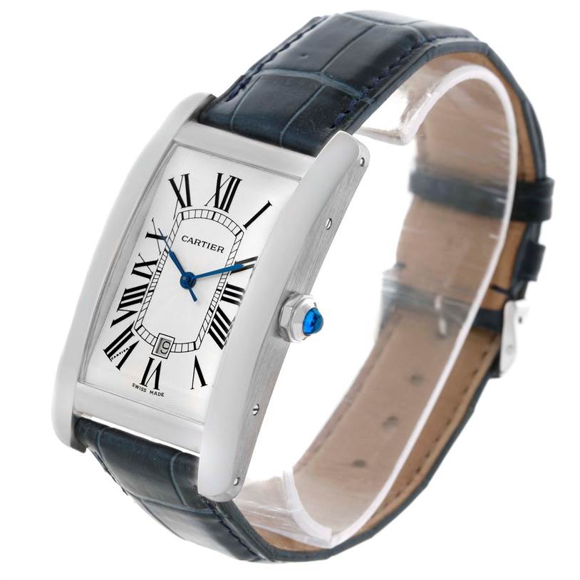 The image shows the Cartier Tank Americaine W2603256 Men's White Gold Silver Dial W2603256 Men's White Gold Silver Dial watch from a front angle, displaying its face, hands, crown, and strap.