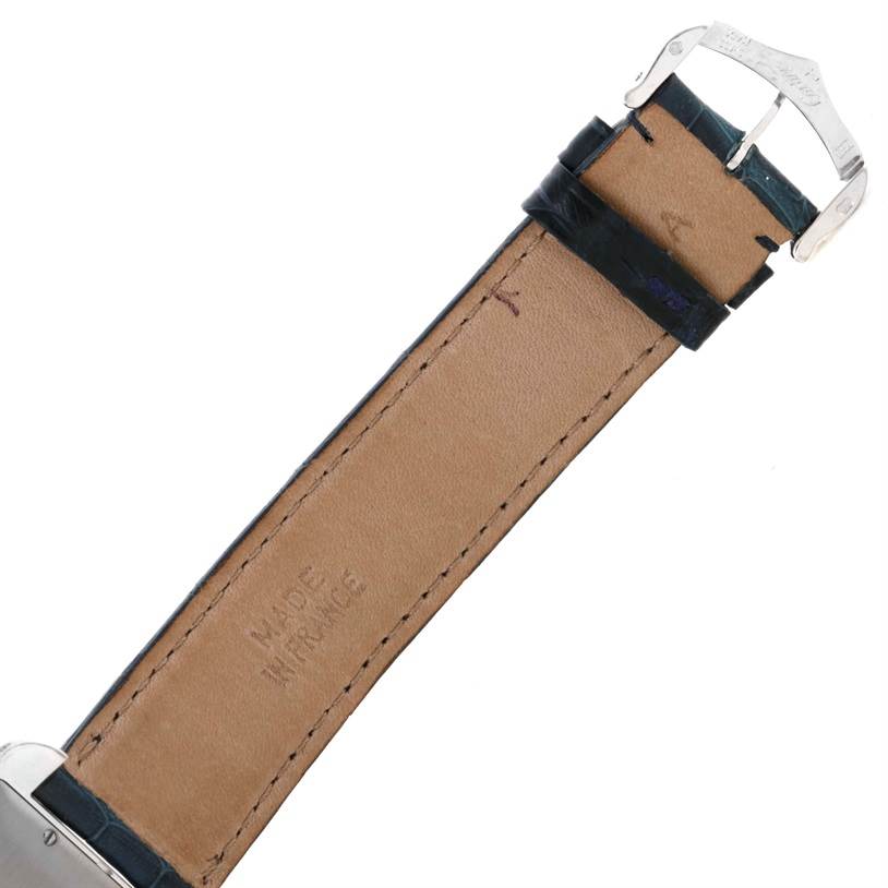 The image shows the underside of the leather strap and clasp of a Cartier Tank Americaine W2603256 Men's White Gold Silver Dial W2603256 Men's White Gold Silver Dial watch.