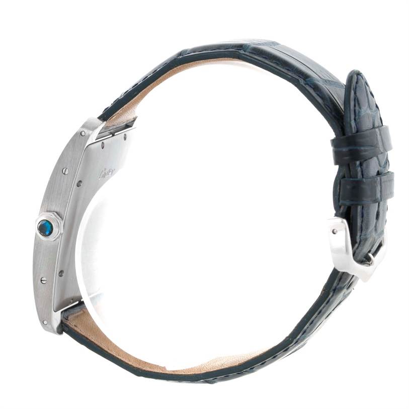 The image shows a side view of the Cartier Tank Americaine W2603256 Men's White Gold Silver Dial W2603256 Men's White Gold Silver Dial watch, highlighting its profile, crown, and leather strap.