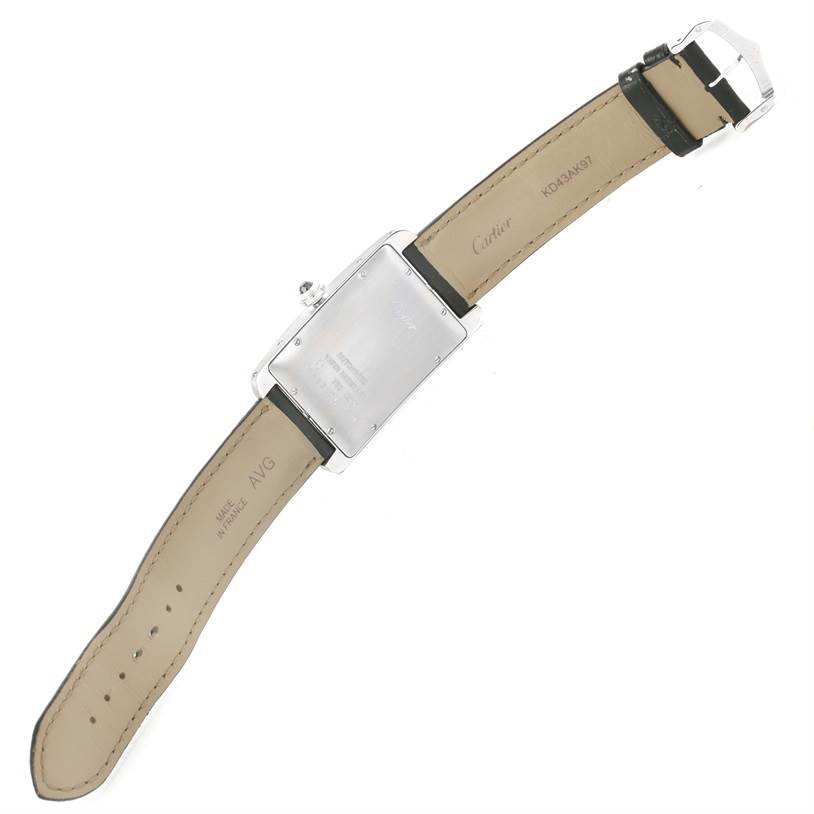 The image shows the back of a Tank Americaine watch by Cartier, including its strap and buckle.