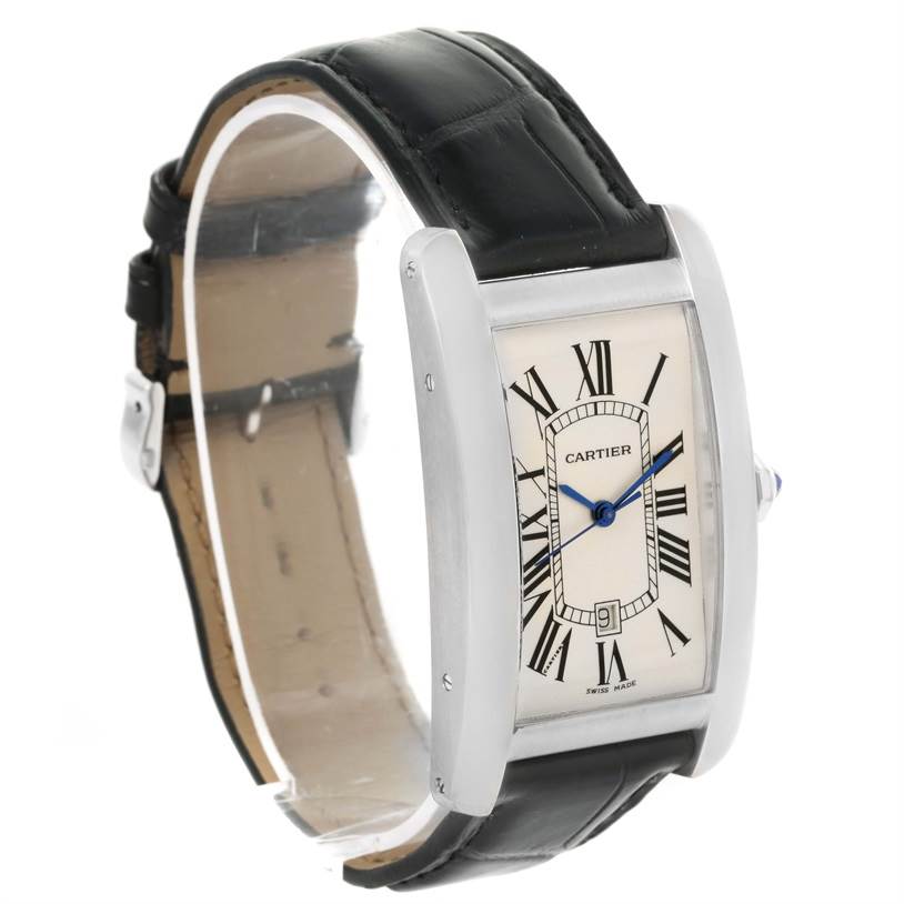 The image shows a side angle view of the Cartier Tank Americaine W2603256 Men's White Gold Silver Dial W2603256 Men's White Gold Silver Dial watch, displaying its face, dial, and black leather strap.