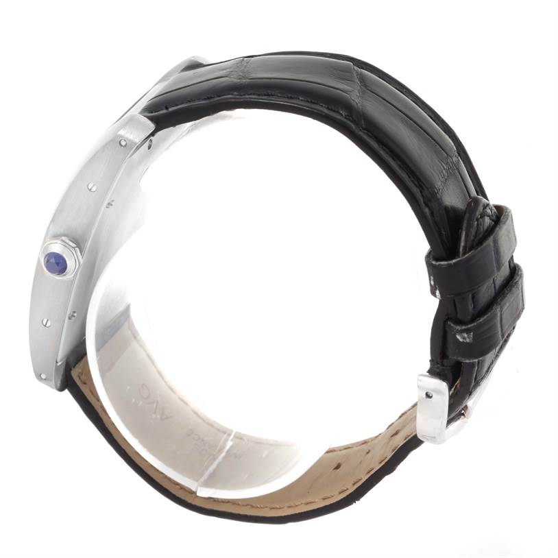 The image shows the side view of a Cartier Tank Americaine W2603256 Men's White Gold Silver Dial W2603256 Men's White Gold Silver Dial watch, highlighting the strap, buckle, case, and crown.